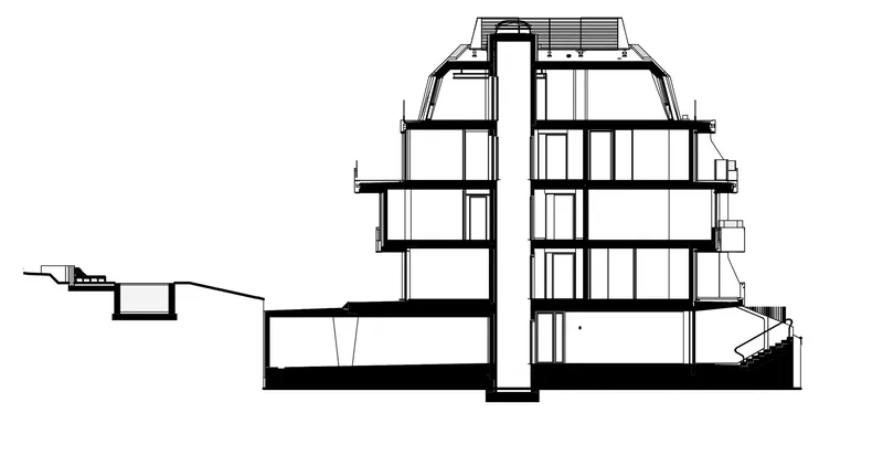 Section drawing showing two offset building volumes connected by a basement level