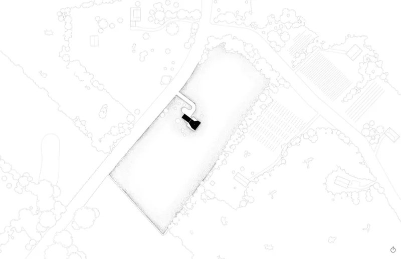 Site plan drawing showing the L-shaped building footprint surrounded by landscape contours and vegetation