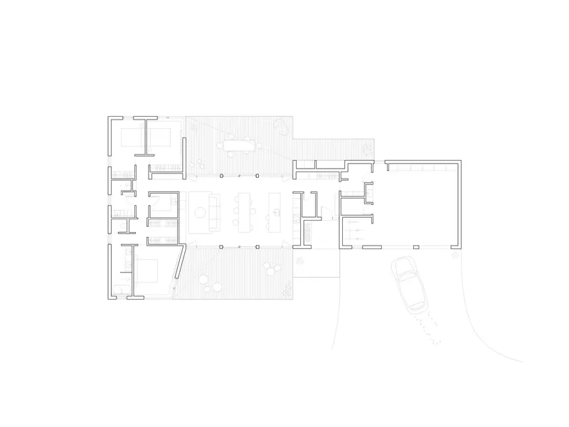 Floor plan drawing depicting rooms arranged along a central corridor with a carport at right