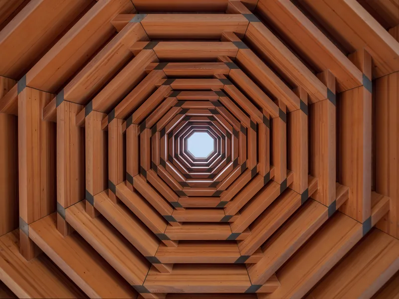 Upward view through an octagonal timber skylight with concentric stepped beams converging toward a central opening