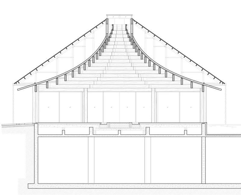 Section drawing showing the sloped roof trusses and column supports over two floor levels