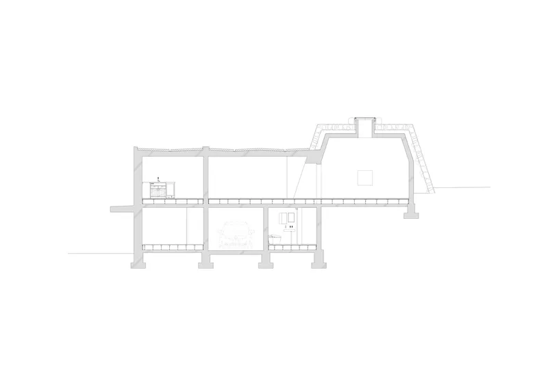 Longitudinal section drawing showing two-story interior spaces with columns and sloped roof profiles
