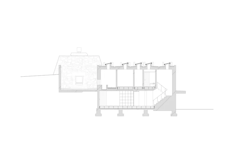 Transverse section drawing showing row of rooms with clerestory windows and exterior stair