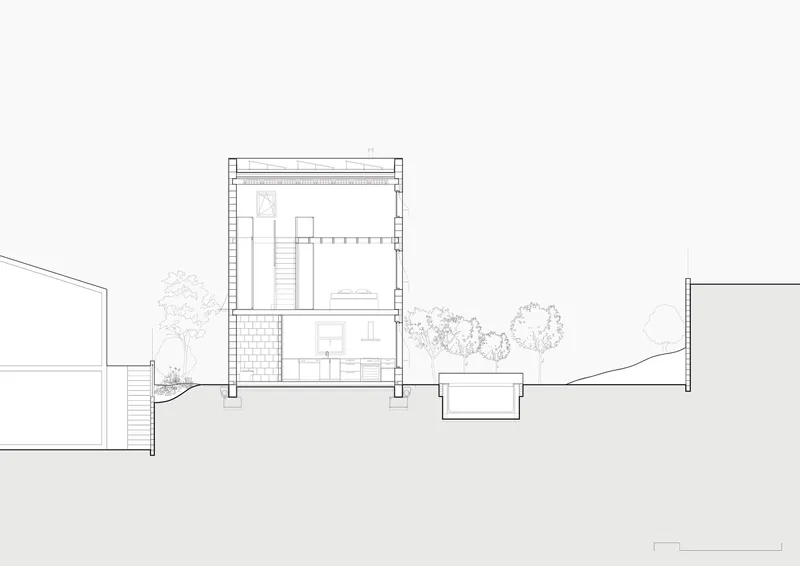 Section drawing revealing interior spaces with central staircase and surrounding landscape with trees