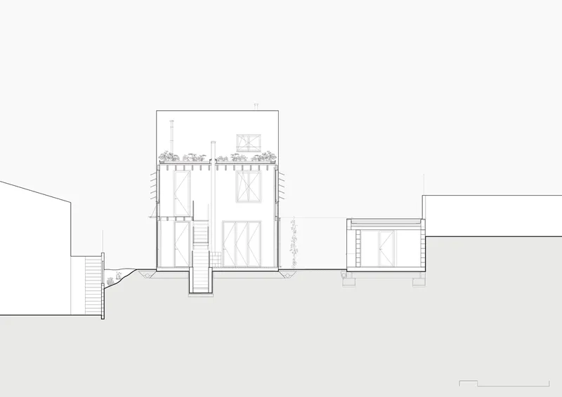 Section drawing displaying a tall volume with double-height space, rooftop garden, and neighboring lower structure