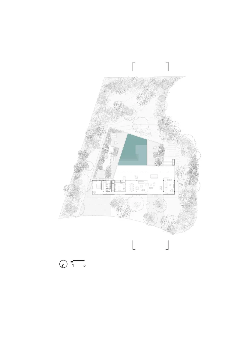 Ground floor plan drawing showing linear living spaces adjacent to a pool and landscaped perimeter