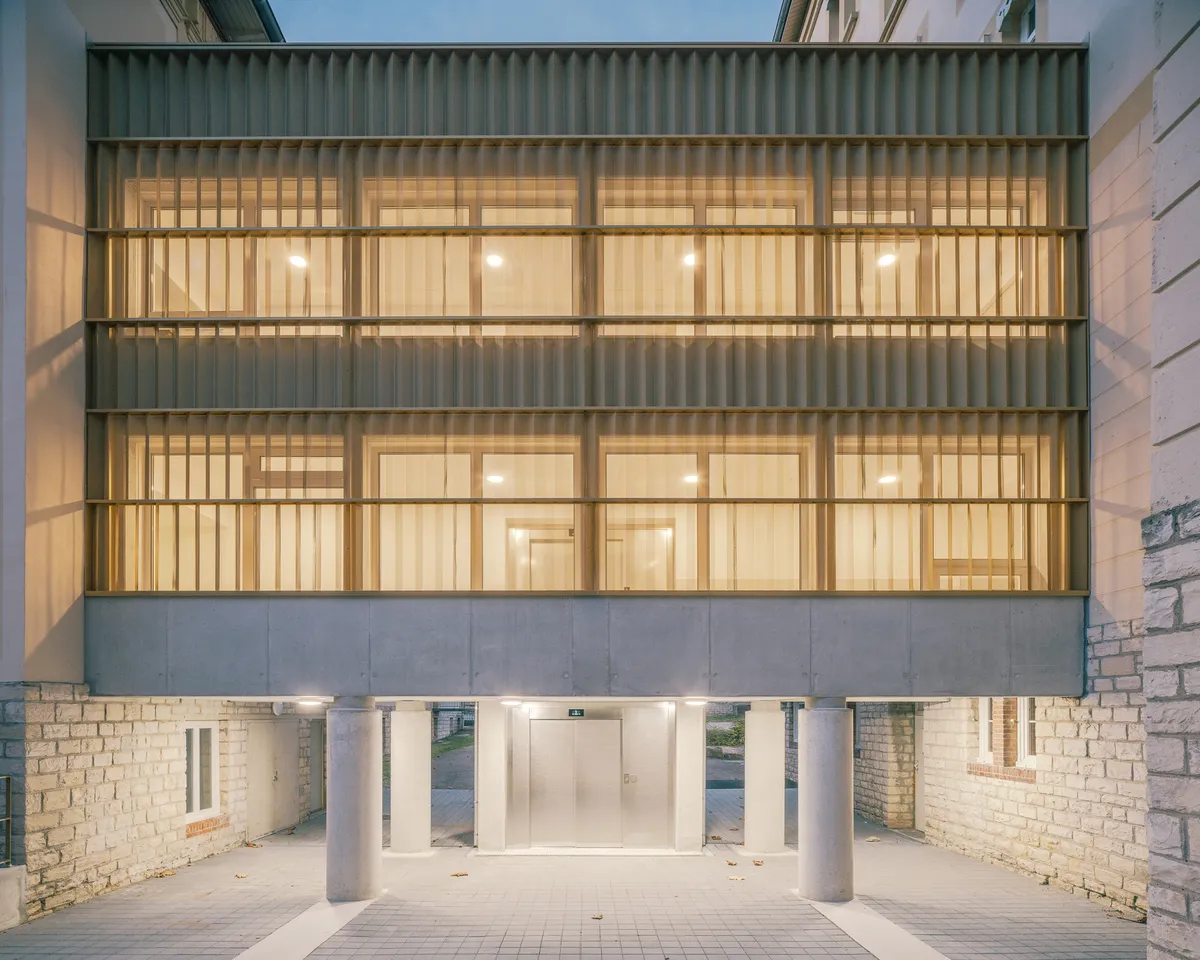 Agence Vulcano-Gibello Threads a Timber Gallery Between Heritage Wings of a Burgundy Retirement Home