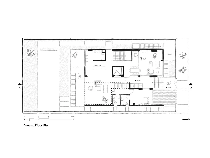 Ground floor plan drawing showing two residential units with central courtyards and staircases