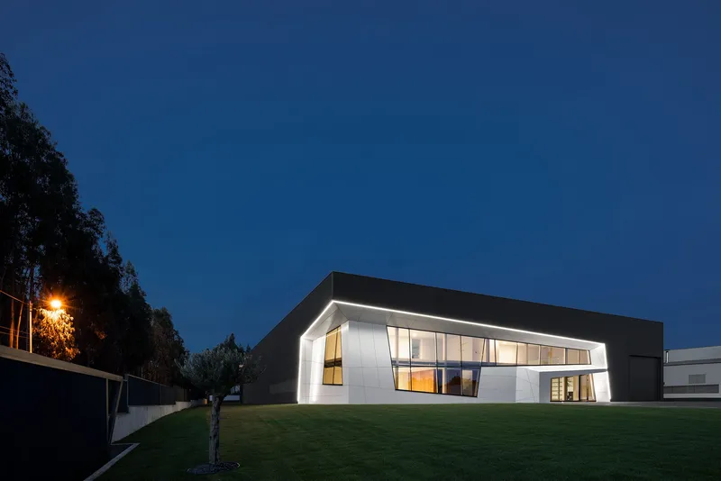 Sharp roofline and angled envelope emphasizing a futuristic architectural language.