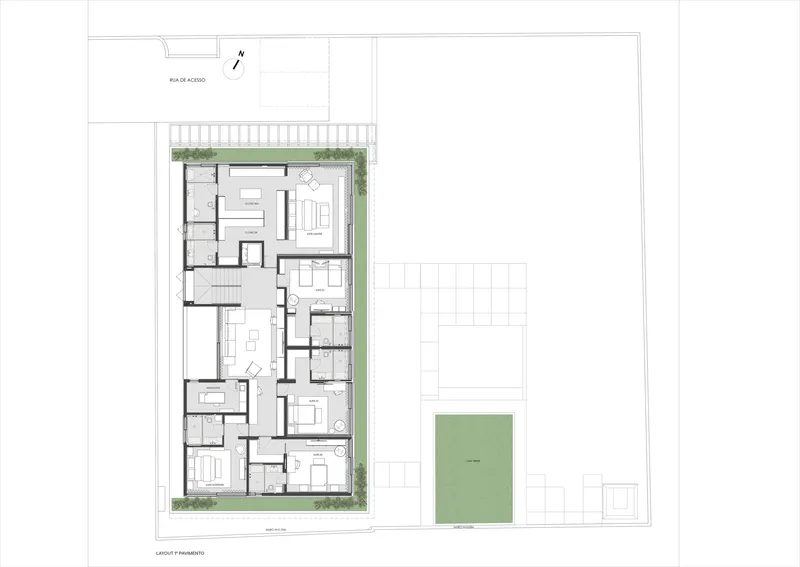 Ground floor plan drawing of a linear residence with rooms flanking landscaped edges