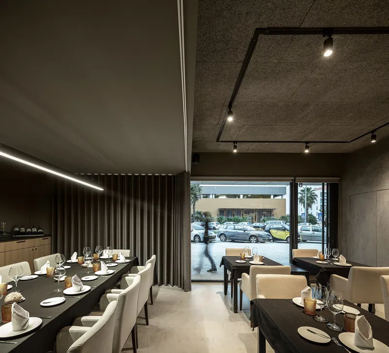 Framed views and layered transparency enhance depth, movement, and spatial experience within the restaurant.