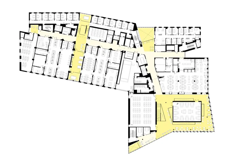 Floor plan showing angled wings with offices and circulation corridors highlighted in yellow