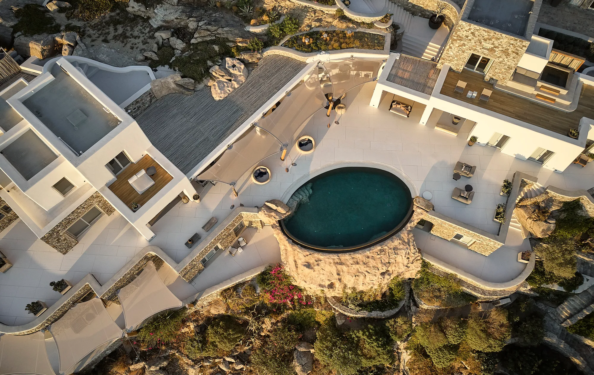 Nikos Adrianopoulos Carves an 820 m² Estate from Rock and Ritual on Mykonos