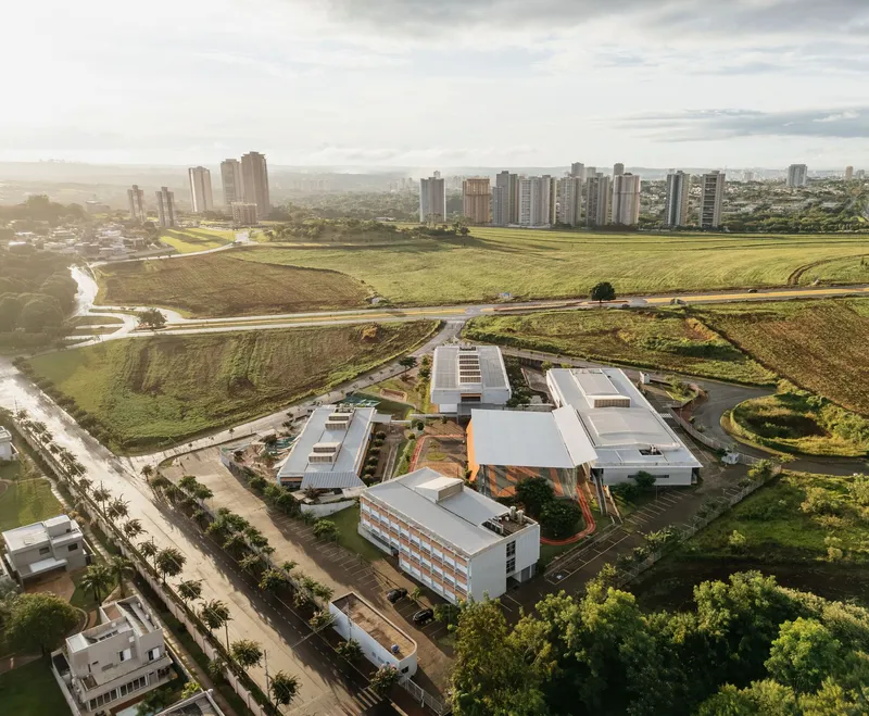 Drone view of the school buildings arranged around a central courtyard at golden hour