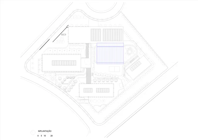Site plan drawing showing campus layout with rectangular buildings and central sports field