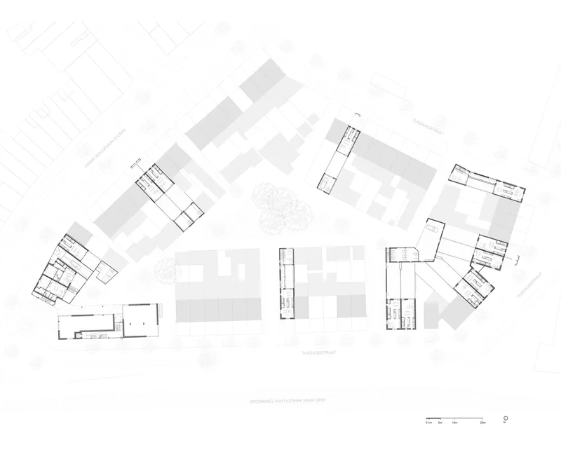Site plan drawing showing multiple building volumes arranged around a central courtyard with a tree