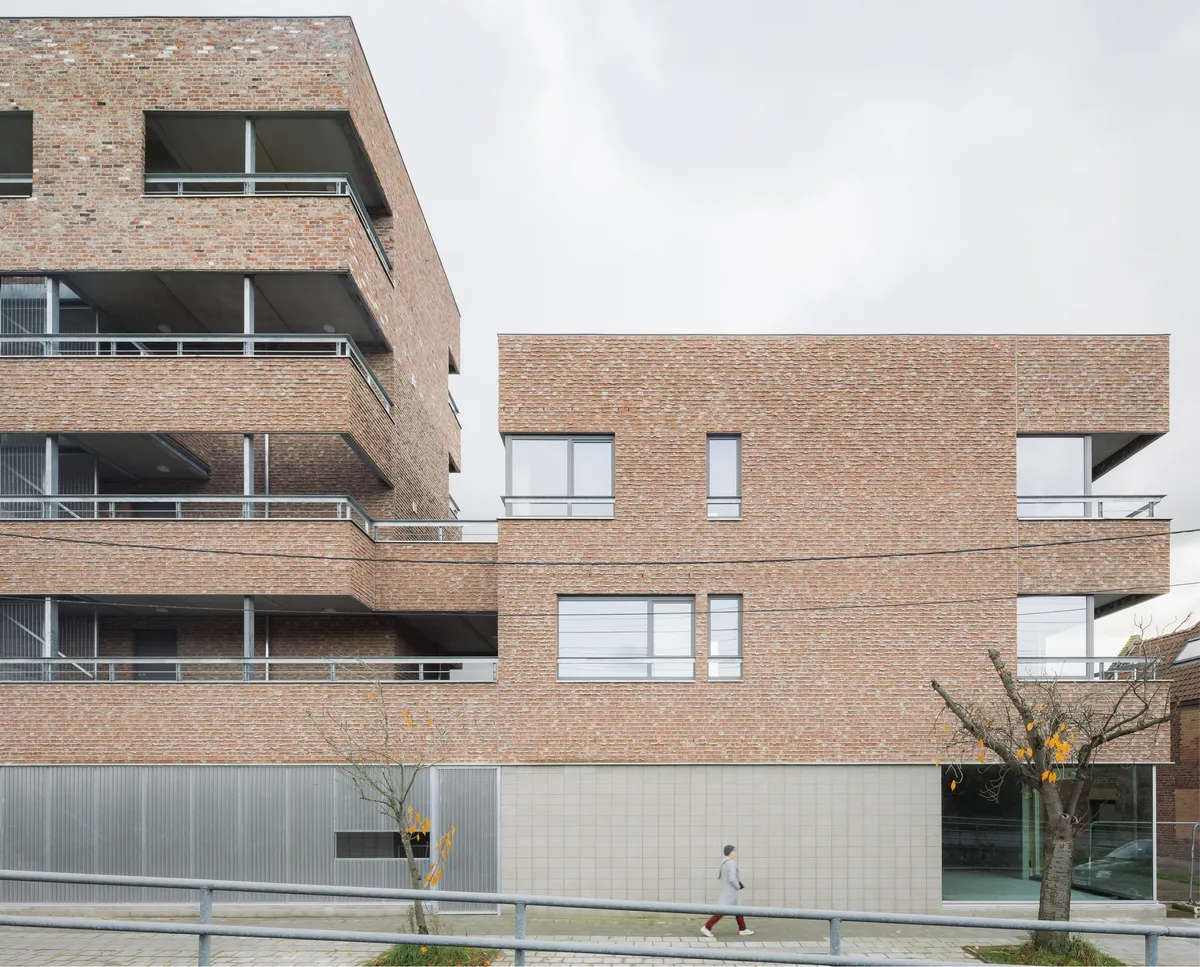 MAKER Architecten Weaves Social Housing into Kortrijk's Dense Urban Fabric with Brick and Restraint
