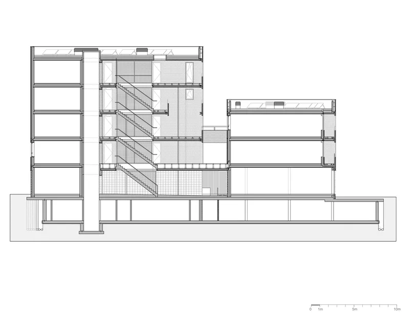 Building section revealing internal staircase connecting multiple levels within a tower and lower wing