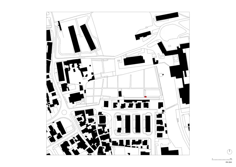 Site plan drawing showing building footprints in black within a neighborhood street grid