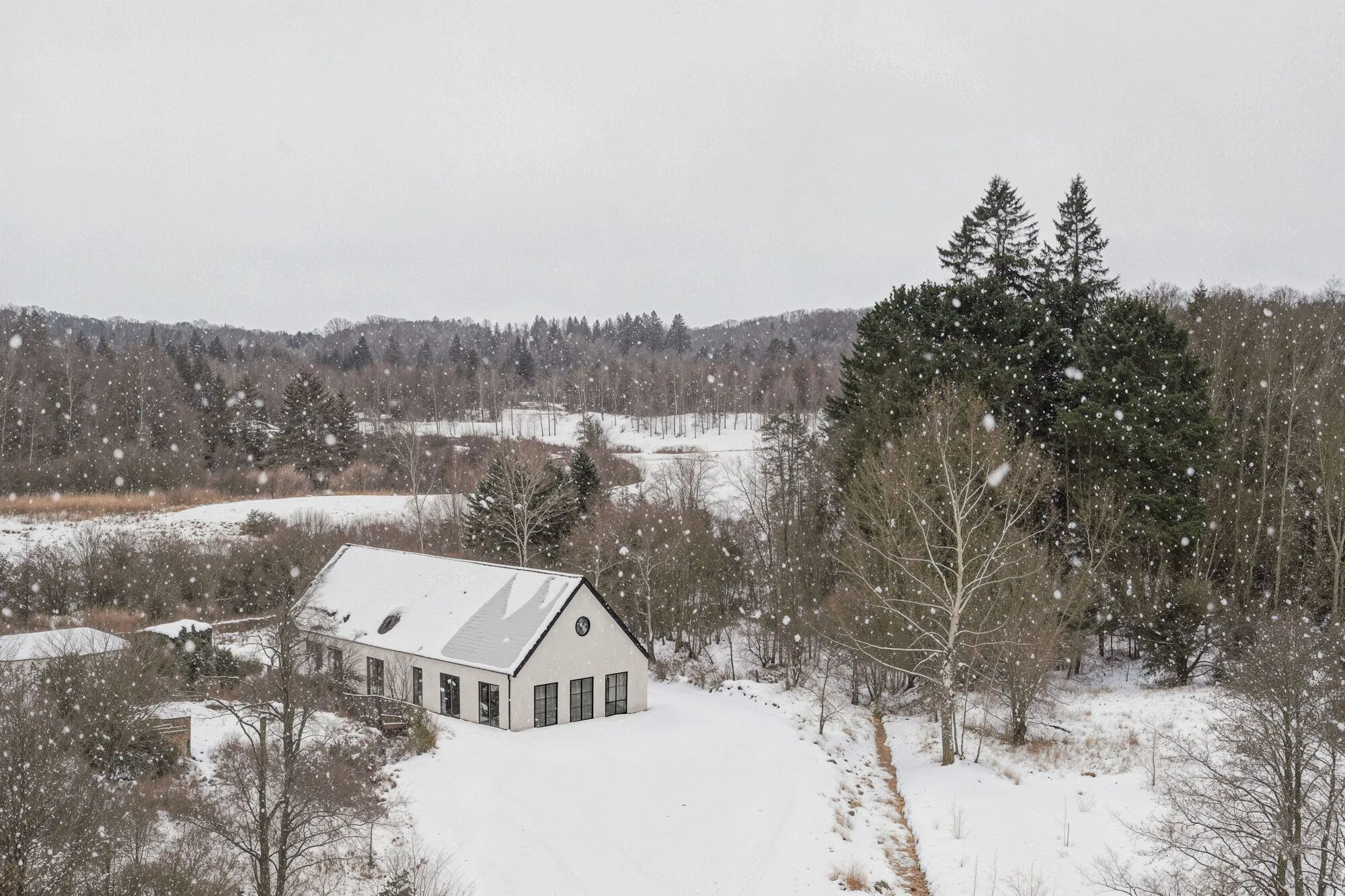 NORM Architects Distill a Danish Lakeside Home to Its Barn Essentials