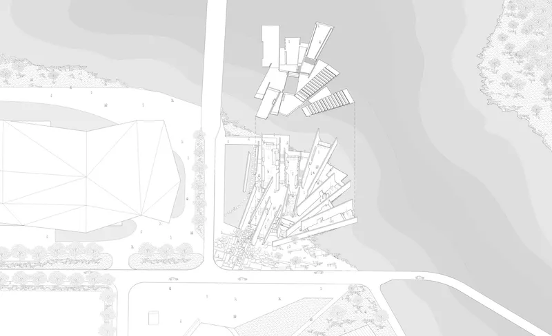 Site plan drawing with landscaping showing upper and lower building clusters beside roadway and water