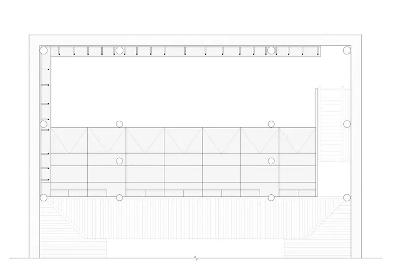 Section drawing showing structural column grid with diagonal bracing and a stepped landscape element below