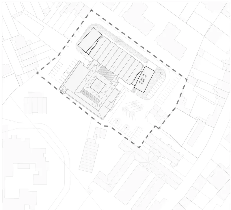 Site plan drawing showing building footprint with sawtooth roof and adjacent street network