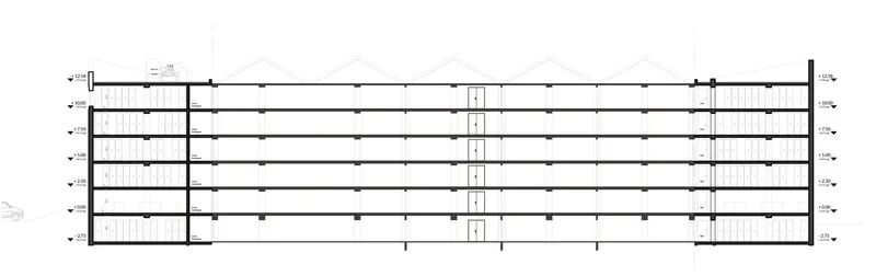 Floor plan drawing showing a long rectangular layout with central circulation core and stairwells at each end
