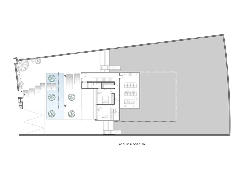 Ground floor plan showing entrance courtyard with water feature and interior rooms with sloped roof