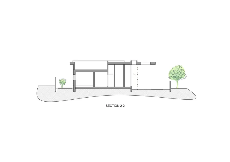 Section drawing revealing double height spaces and material transitions on sloping terrain
