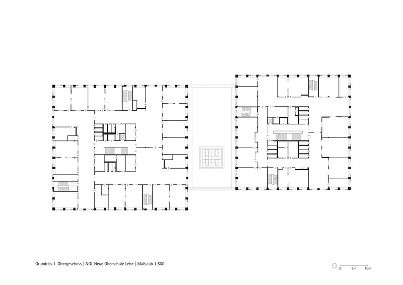 Floor plan drawing showing two rectangular buildings with perimeter columns and internal room divisions