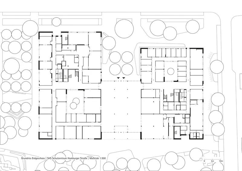 Ground floor plan drawing showing four building volumes arranged around a central courtyard with trees