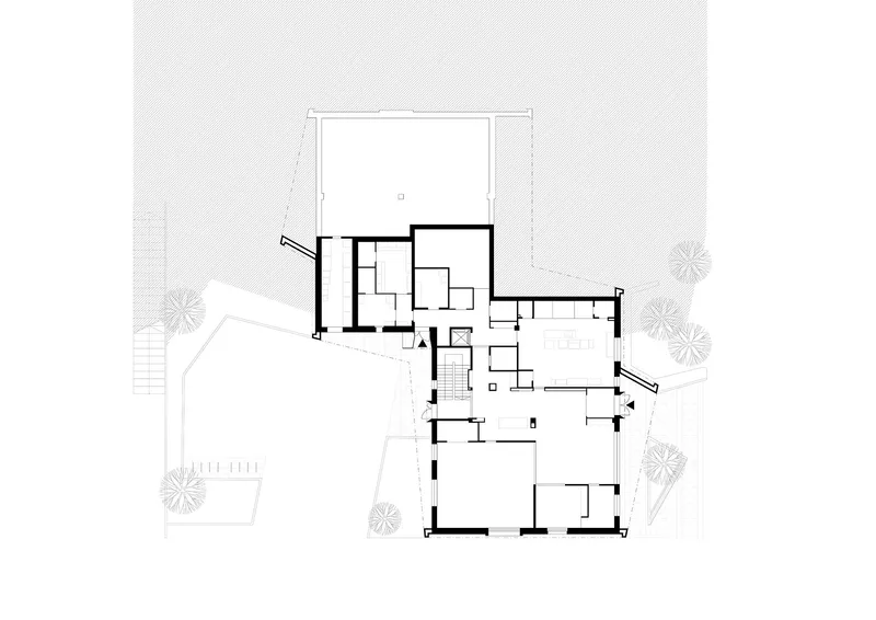 Floor plan drawing showing residential units organized around a central stairwell with exterior terraces