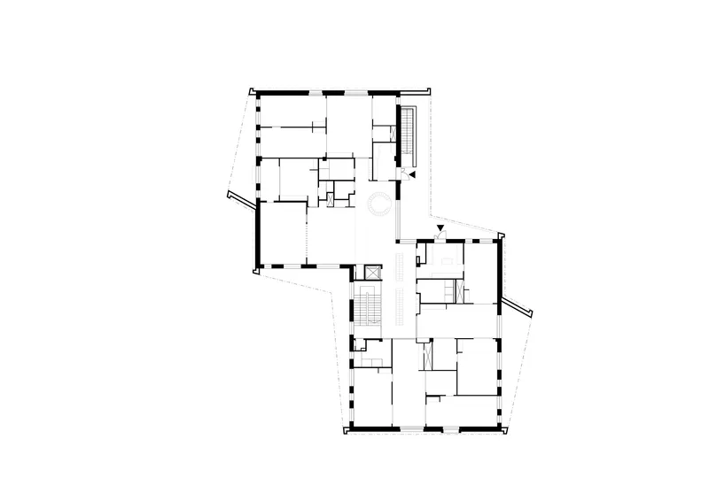 Floor plan drawing showing two connected volumes with central staircases and perimeter rooms