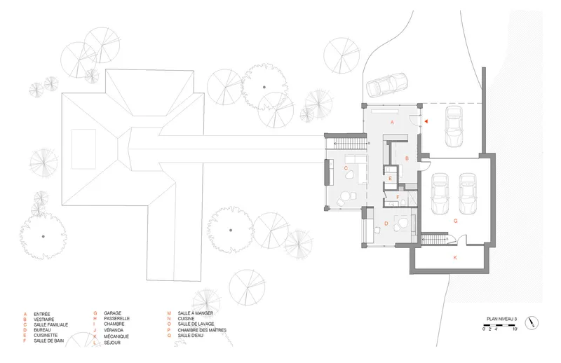 Site plan drawing showing an existing house with trees and a new garage addition with cars
