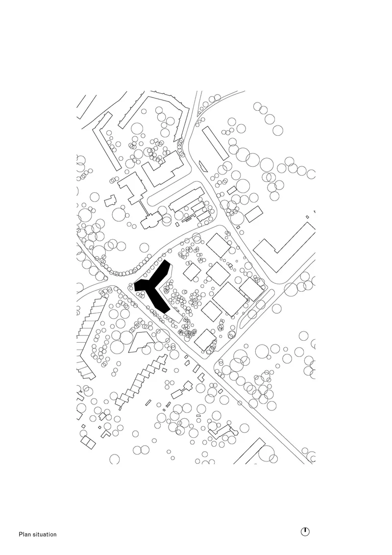 Site plan drawing showing building footprints and tree canopies with one structure highlighted in black
