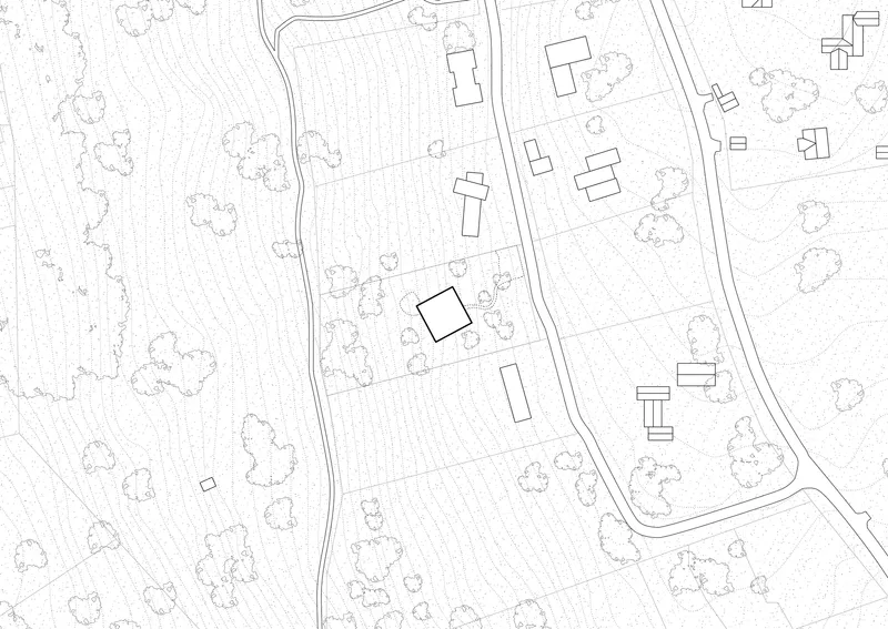 Site plan drawing showing rectangular building footprint among scattered tree symbols and curving road