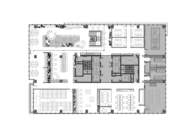 Floor plan drawing showing terraced outdoor area and reconfigured workspaces with central cores