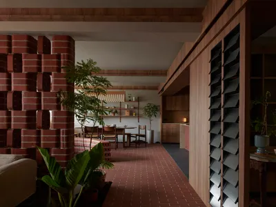 A Horticulturist's Home Wrapped in Brick and Green