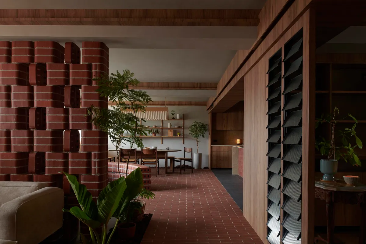 A Horticulturist's Home Wrapped in Brick and Green