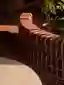 This architectural image showcases a curved brick wall, likely part of an outdoor space such as a co