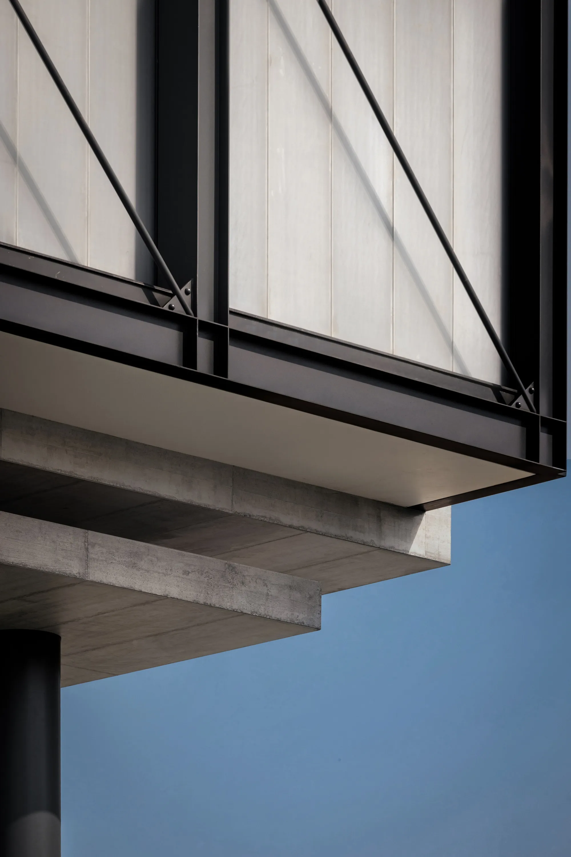 Minimalist Architecture and Design Studio Float a Concrete House Above Ludhiana's Streetscape