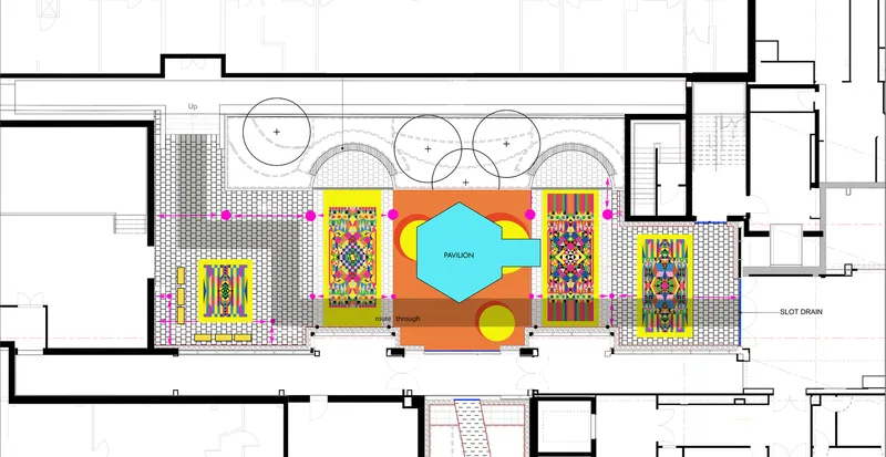 Floor plan drawing showing a central courtyard with colorful geometric artworks and circular planters