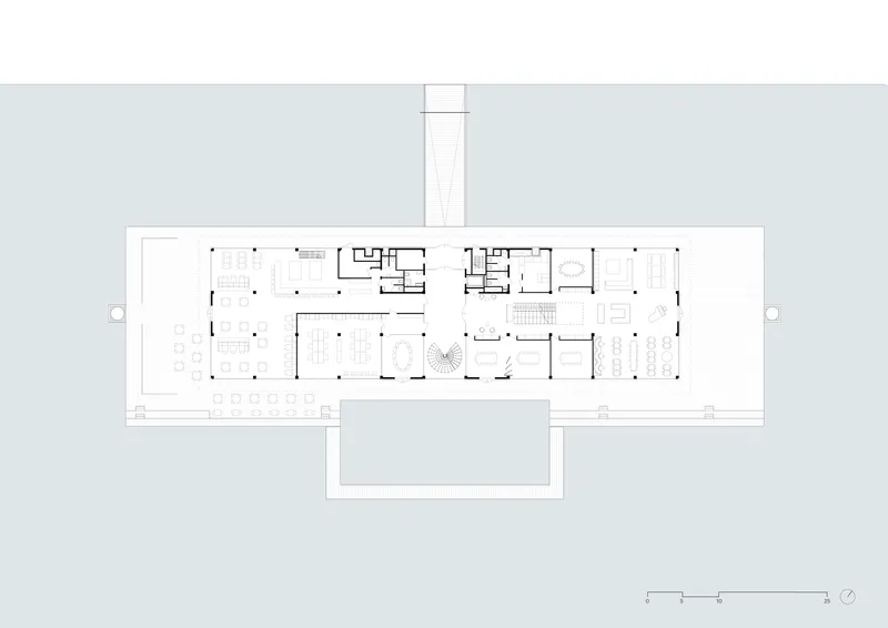 Ground floor plan drawing showing elongated rectangular layout with central courtyard and surrounding workspaces