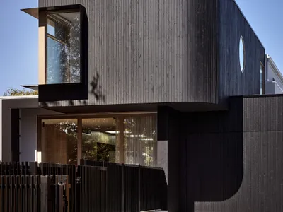 Atlas Architects Wraps a Brighton Family Home in Corrugated Metal and Curved Timber