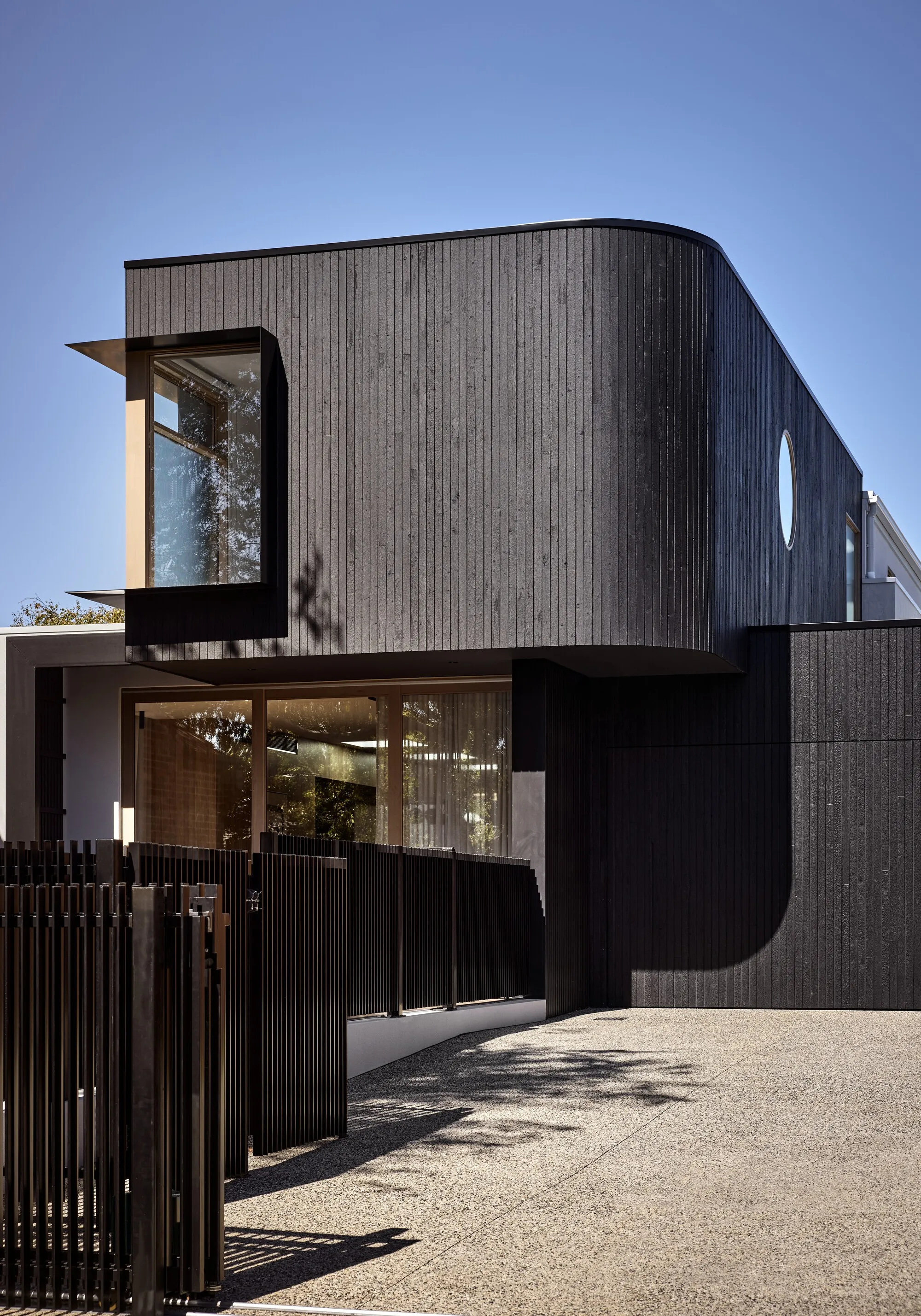 Atlas Architects Wraps a Brighton Family Home in Corrugated Metal and Curved Timber