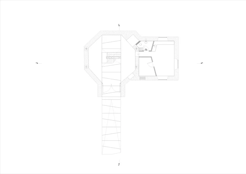 Floor plan drawing revealing a linear arrangement with stairs and two distinct spatial zones