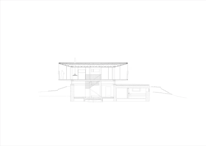 Section drawing showing a two-story residence with flat roof set into sloping terrain