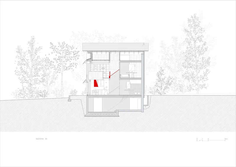 Building section drawing revealing split-level interior spaces with red accent wall between flanking trees
