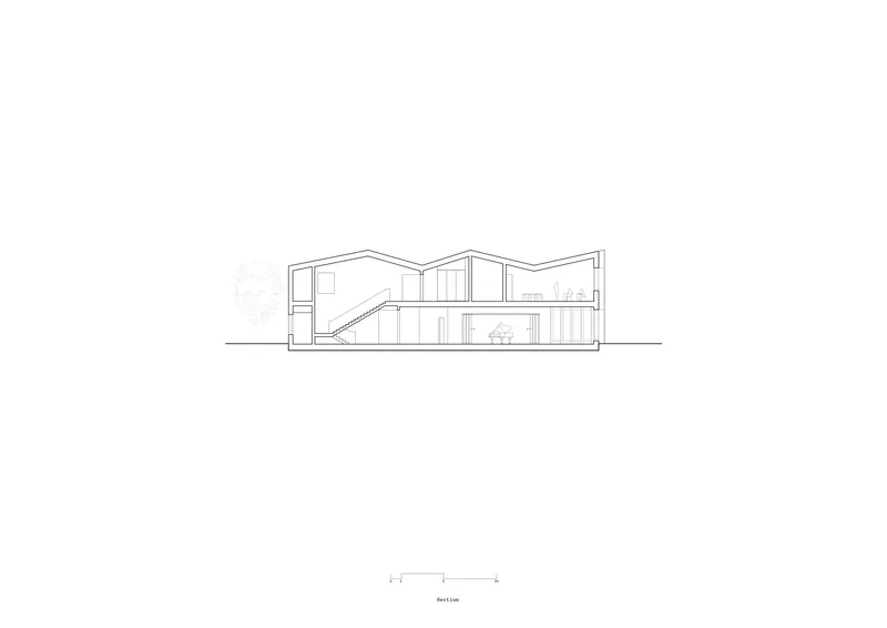 Section drawing showing interior staircase and zigzag roofline with adjacent tree outline
